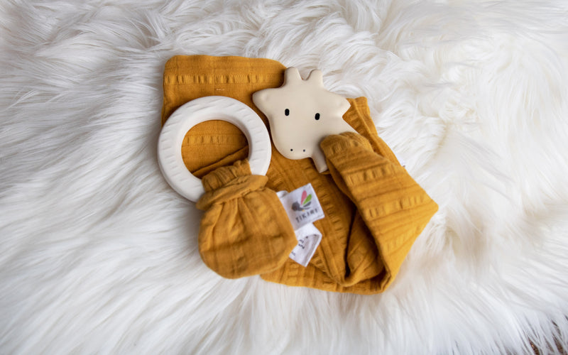 Giraffe Rubber Teether with a Mustard Muslin Comforter